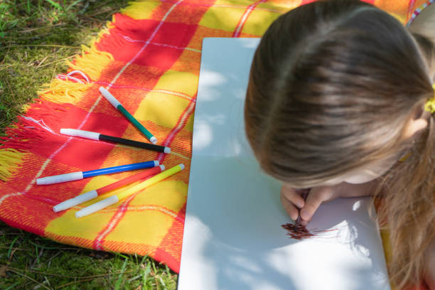 istock Colorful felt tip pen lie on a colored blanket. Leisure in kindergarten 1152810189