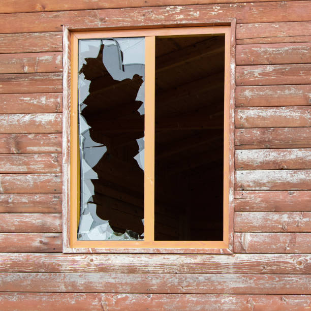 istock Cracked and broken glass window. Vandalism fracture 1152810399