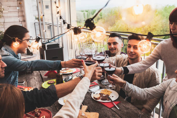 istock Happy group of friends drinking red wine 1152810745