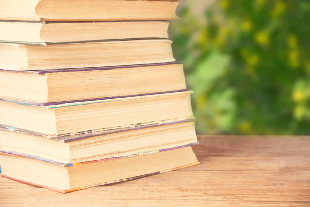 istock old books row on the nature background 1152810890