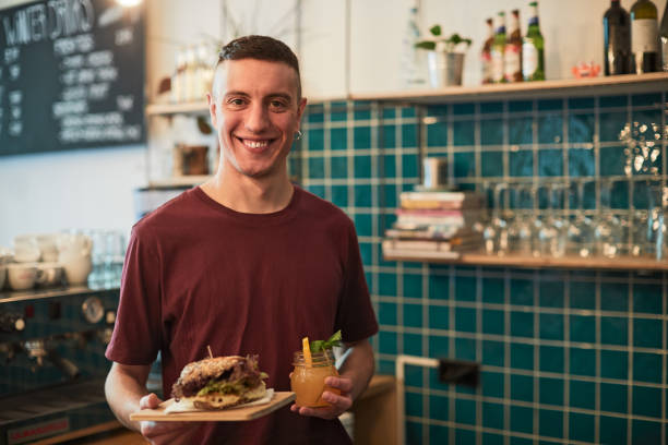 istock Coffee shop barista looking at camera. Portrait with copy space. 1152812046
