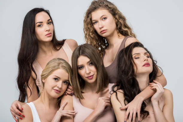 istock beautiful young women support each other isolated on grey 1152812212