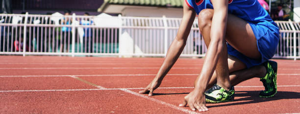 istock Cropped image of a sprinter getting ready to start at the stadium 1152814381
