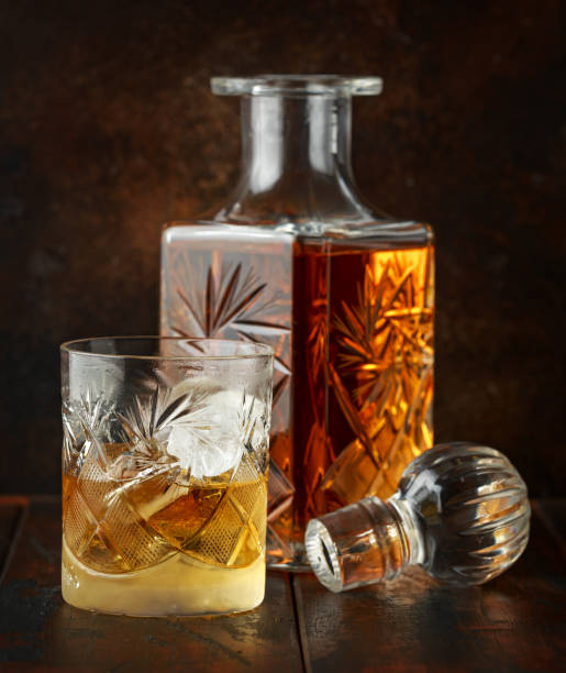 istock Crystal decanter and glass with whiskey and ice 1152817184