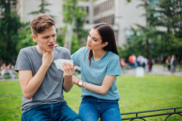 istock Woman hugging man with sore throat 1152818475