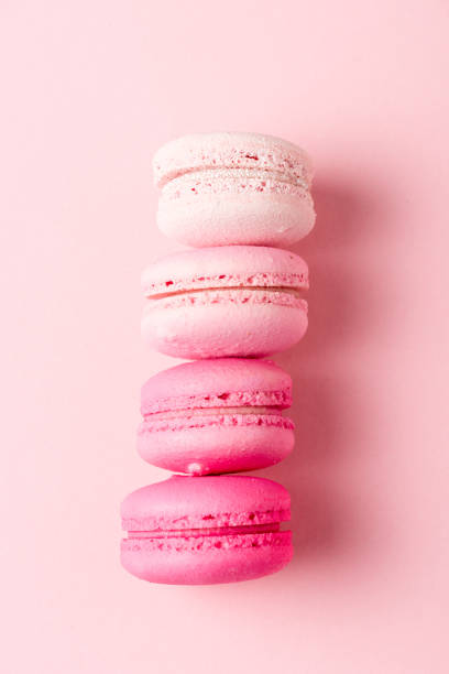 istock top view of colorul macarons on pink surface 1152821106