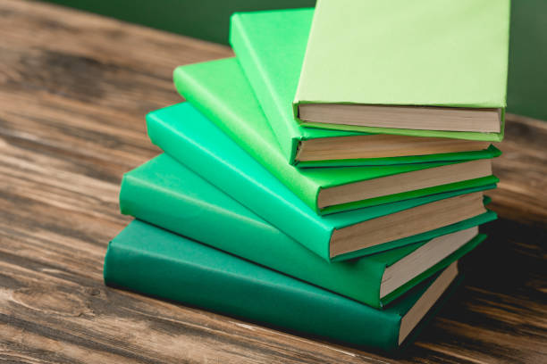 istock stack of colorful books on wooden textured surface 1152821335