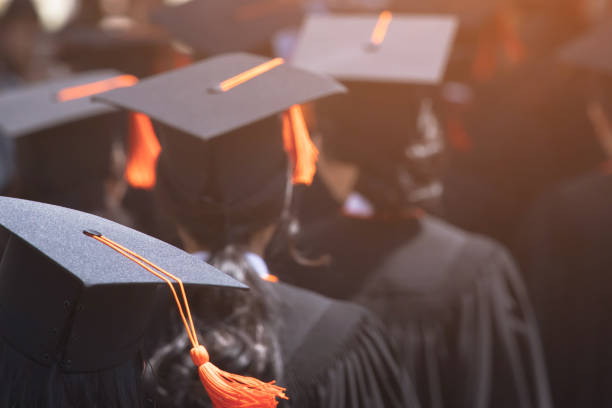 istock Group of Graduates during commencement. Concept education congratulation in University. Graduation Ceremony 1152822558