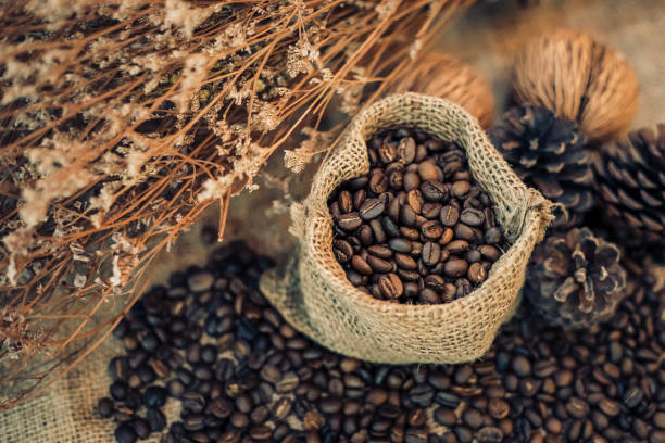 istock Roasted coffee beans in a sack on dark background 1152824005