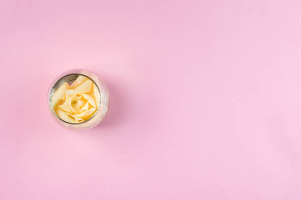 istock White roses in jars on a pink background with copy space, fla lay 1152824778