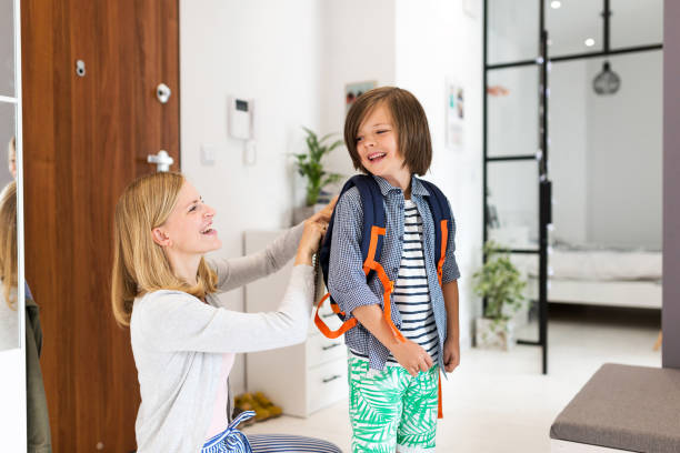 istock Mother helping son get ready for school 1152826522