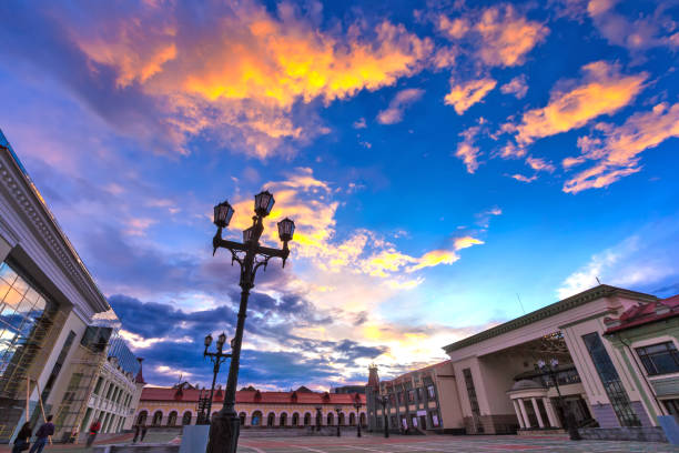 The central city square with beautiful modern architecture for the rest of the locals under a blue sky with colorful clouds.