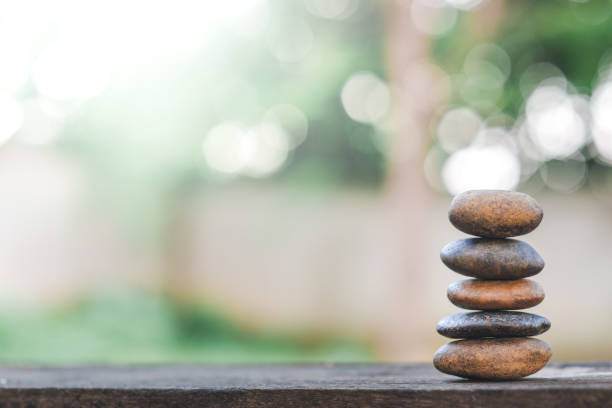 istock Balance stone with spa on abstract bokeh nature background 1152829430