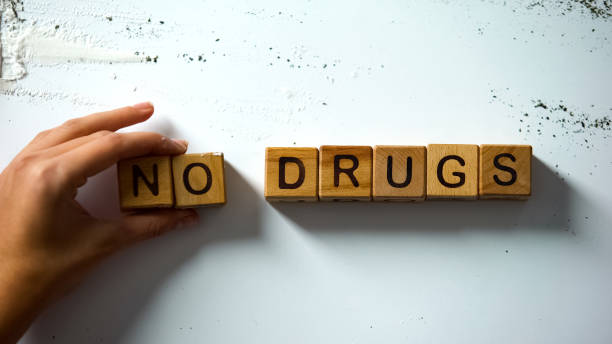 no drugs words made of wooden cubes, harmful narcotics effect, addiction concept - photography sign table ganja imagens e fotografias de stock