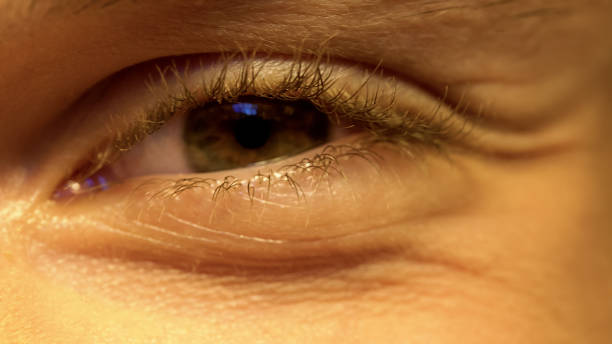 istock Young person having poor vision, squinting eyes, ophthalmology, extreme close-up 1152831045