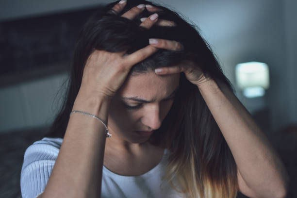 istock Depressed woman at home 1152832596