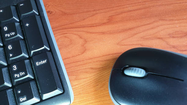 istock Aerial view of keyboard and mouse with copy space 1152834905