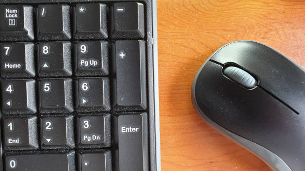 istock Aerial view of keyboard and mouse with copy space 1152834907