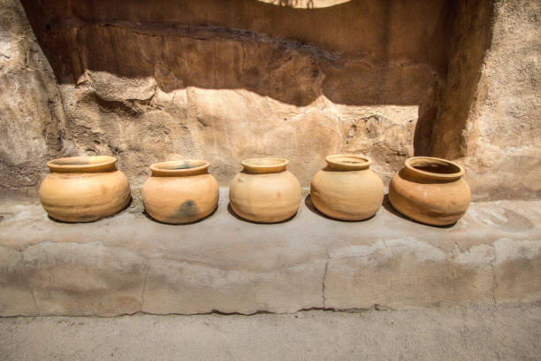 istock Ancient Clay Pots In Row Outside An Adobe 1152835013