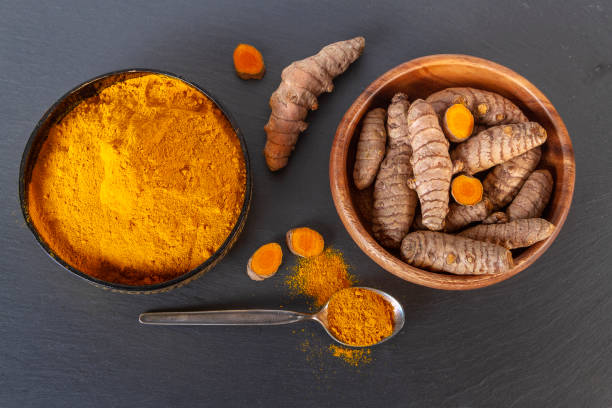 istock Turmeric on gray slate background. Top view overhead shot 1152836682