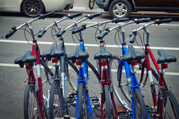 istock Red and blue bicycles on a bike rack 1152837873