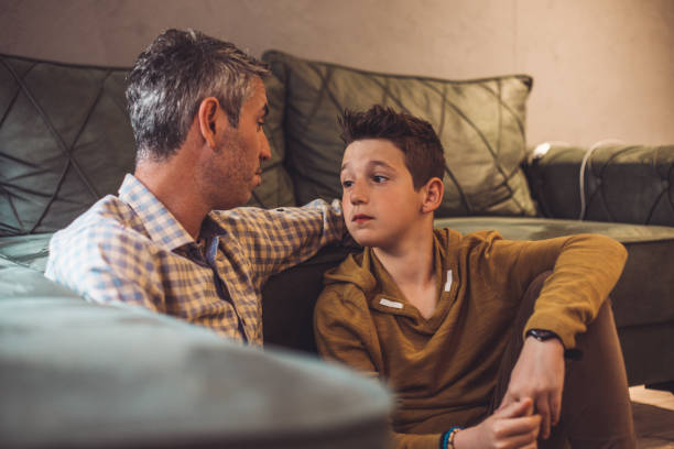 Father and son time Father and son time serious talk stock pictures, royalty-free photos & images