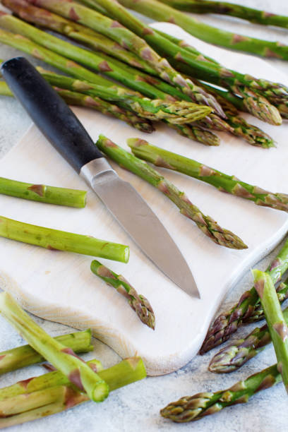 istock Fresh asparagus with knife 1152839044