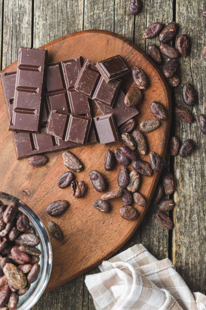 istock Dark chocolate bar and cocoa beans. 1152840711
