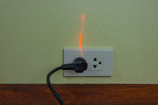 istock On fire electric wire plug Receptacle wall partition,Electric short circuit failure resulting in electricity wire burnt 1152840974