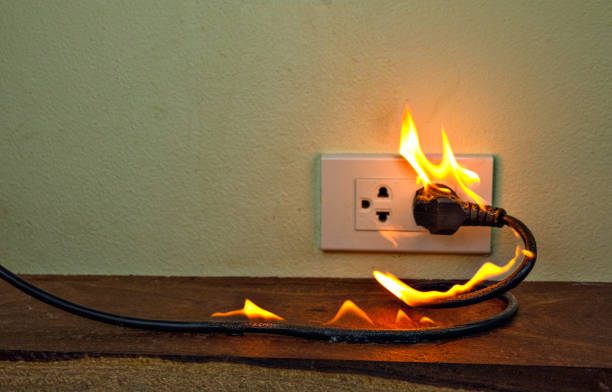 istock On fire electric wire plug Receptacle wall partition,Electric short circuit failure resulting in electricity wire burnt 1152840980