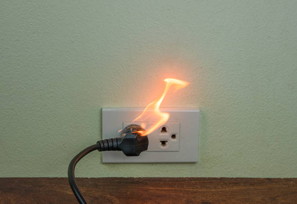 istock On fire electric wire plug Receptacle wall partition,Electric short circuit failure resulting in electricity wire burnt 1152840981