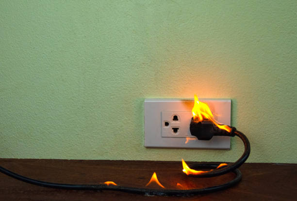 istock On fire electric wire plug Receptacle wall partition,Electric short circuit failure resulting in electricity wire burnt 1152841017