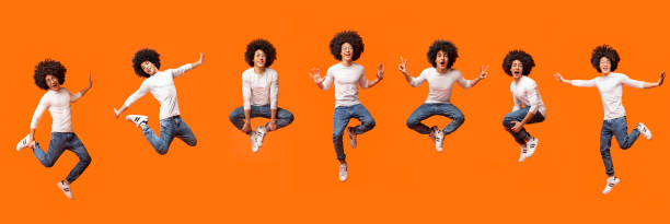 istock Collage of jumping bushy black guy on orange 1152843050