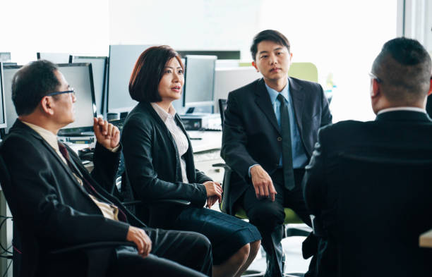 istock White collar workers discussing over business plan 1152843325