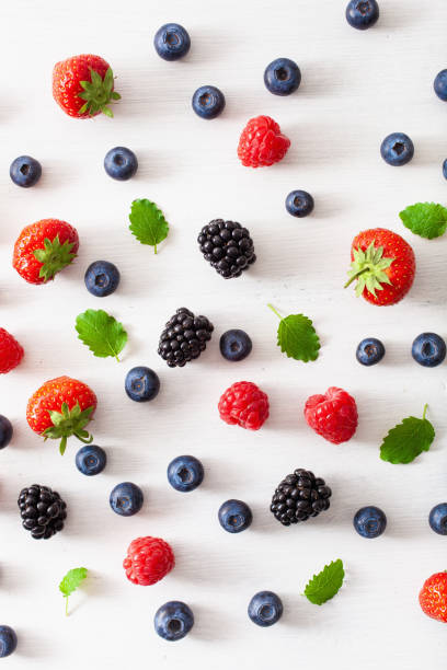 istock assorted berries over white background. blueberry, strawberry, raspberry, blackberry 1152843425