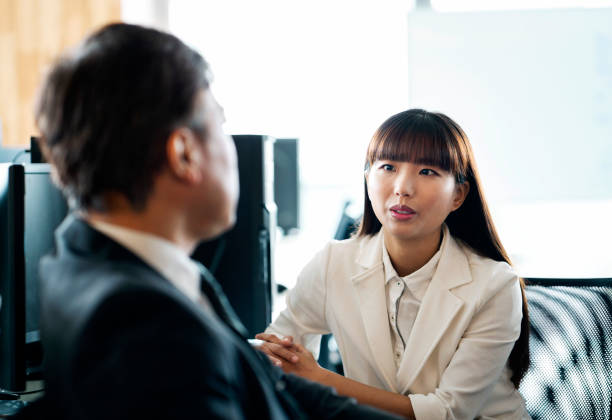 istock Female executive working with colleague in office 1152843441