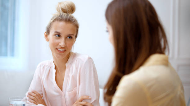 istock Two cheerful teenage girlfriends talking at home. 1152844971