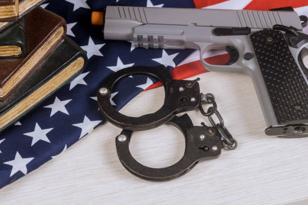 istock Gun control rights weapon USA flag with school shooting gun 1152845195