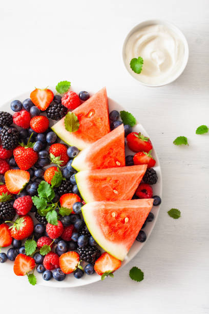 istock fruit and berry platter over white. blueberry, strawberry, raspberry, blackberry, watermelon 1152845634