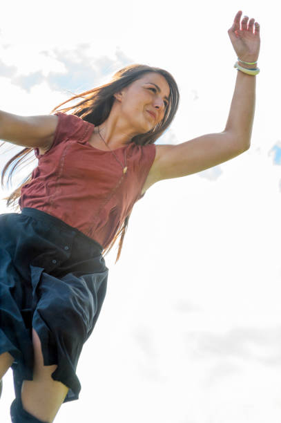 istock young lady jumps up in the air 1152846613
