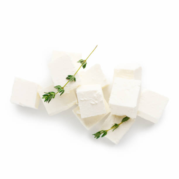 istock Pile of greek cheese cubes on white 1152848333