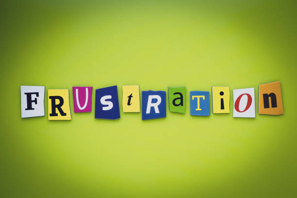 istock A word writing text frustration from cut letters on a green background. Headline - frustration, card of psychology. Banner with inscription frustration. Psychologic concept. 1152848652