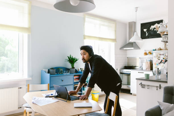 istock Asian man having a video conference call 1152849580
