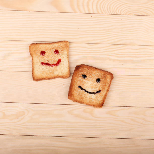 Toast with a smile jam  on wooden table stock photo