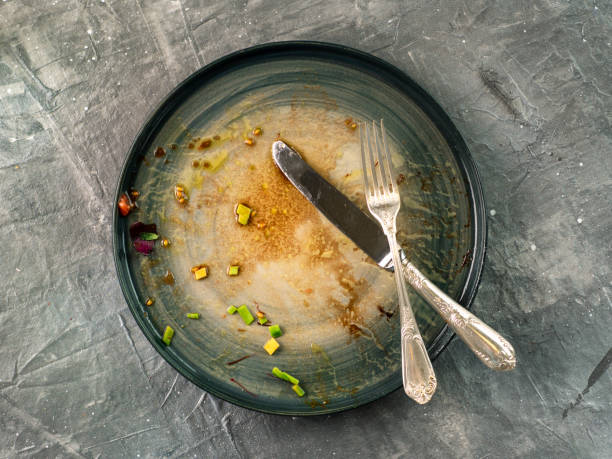 Dirty dish on gray background, top view stock photo