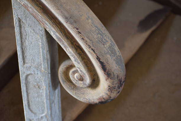 Detail of carved wooden stair railing in Kolmanskop Namibia