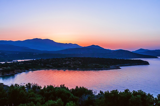 Dramatic orange sunset over the mountain and the Mediterranean Sea