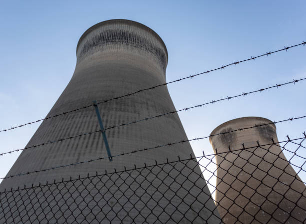 Cooling Towers Behind Barbed Wire stock photo