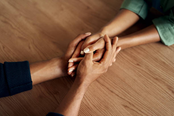 istock People holding their hands tight together 1152853410