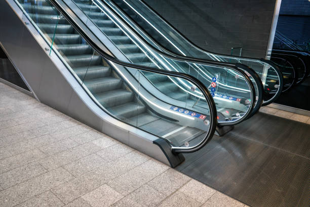 istock Lower floor near illuminated empty escalators in modern building 1152854733